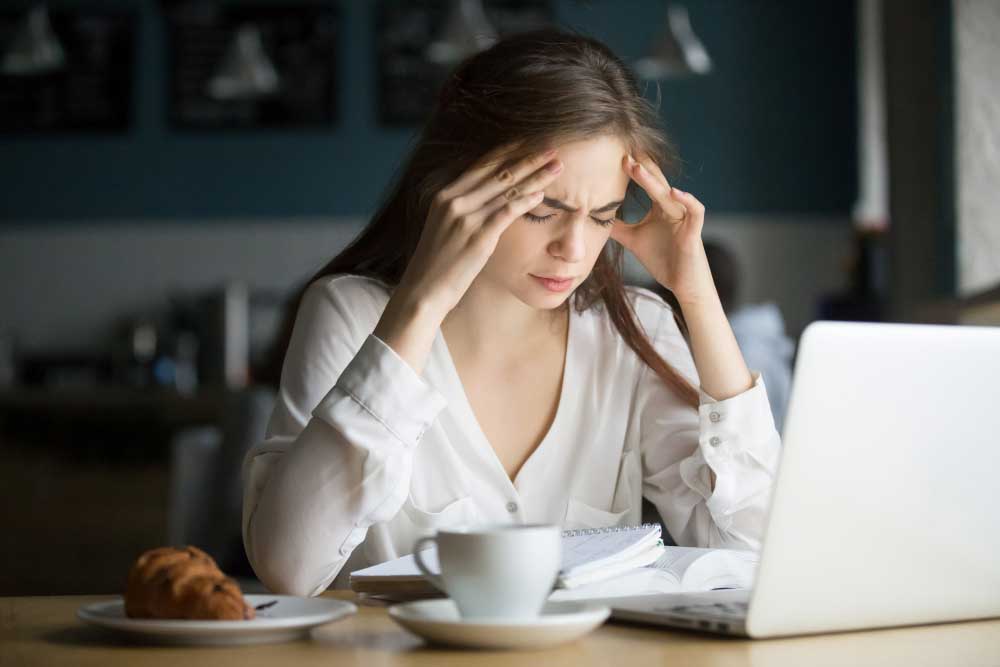 nervous-stressed-female-student-feeling-headache-studying-cafe.jpg