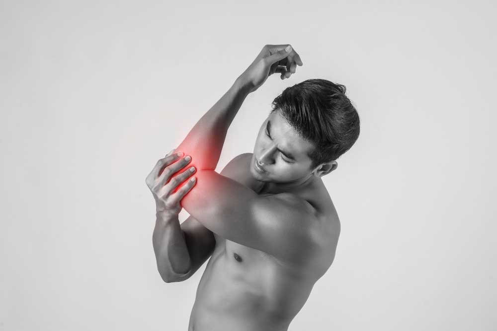 portrait-muscle-man-having-elbow-pain-isolated-white-background.jpg